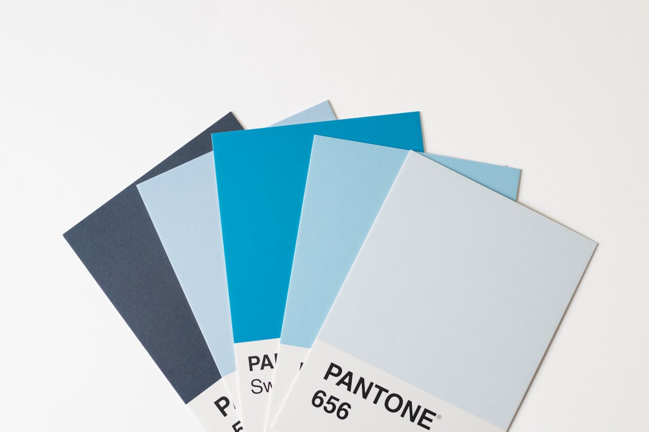 our-story A collection of blue Pantone color swatches arranged on a white background for design inspiration.